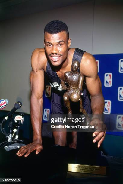 David Robinson of the San Antonio Spurs is presented the MVP Trophy during Game Two of the Conference Finals of the 1995 NBA Playoffs played on May...