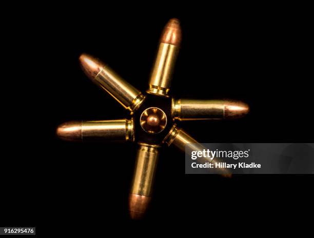 bullets in shape of a flower - kogel stockfoto's en -beelden
