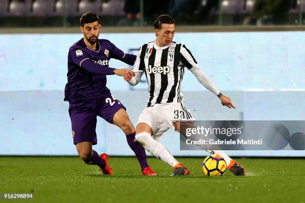 Marco Benassi of ACF Fiorentina battles for the ball with Federico Bernardeschi of Juventus during the serie A match between ACF Fiorentina and...