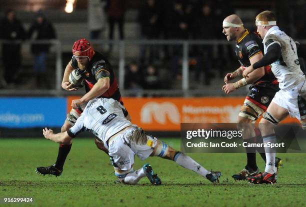 Dragons' Joe Davies is tackled by Glasgow Warriors' Adam Ashe during the Guinness Pro14 Round 14 match between Dragons and Glasgow Warriors at Rodney...