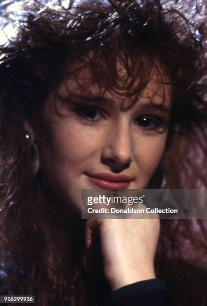 Pop star Tiffany poses for a portait on a TV show in 1987 in Los Angeles, California.