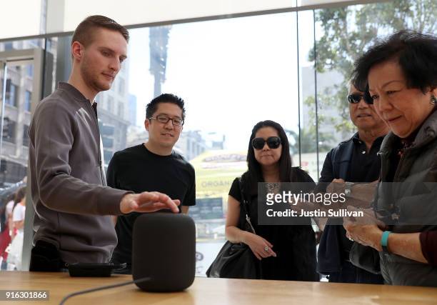 An Apple Store employee demostrates the new Apple HomePod at an Apple Store on February 9, 2018 in San Francisco, California. Apple's new HomePod...