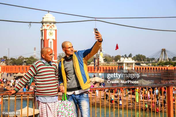 People take selfie at Har ki Pauri in Haridwar, Uttrakhand, India on 8th Feb ,2018.According to hindu culture Har ki Pauri one of the famous ghat and...