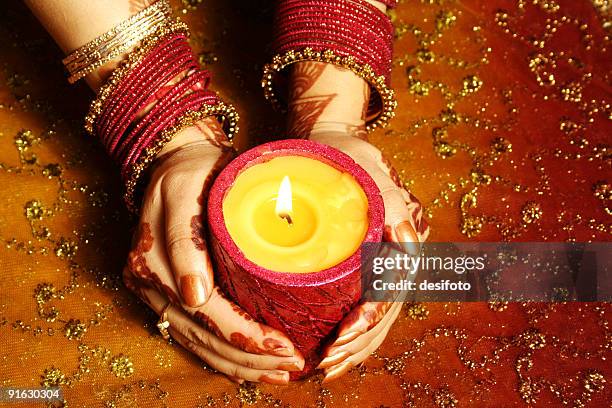 indian lady with candle celebrating - diwali greetings stock pictures, royalty-free photos & images