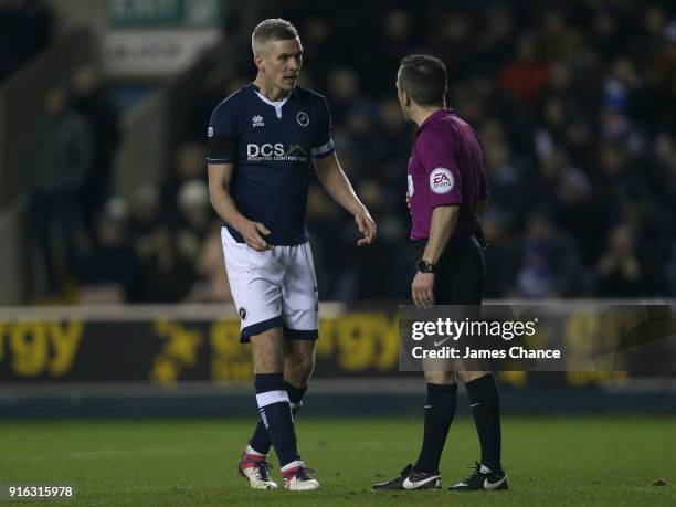 Steve Morison of Millwall argues with referee Keith Stroud during the Sky Bet Championship match between Millwall and Cardiff Cityat The Den on...