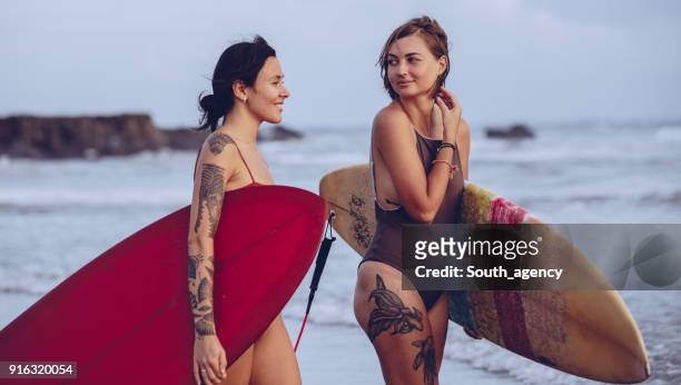 girls love surfing - swimsuit models girls stock pictures, royalty-free photos & images