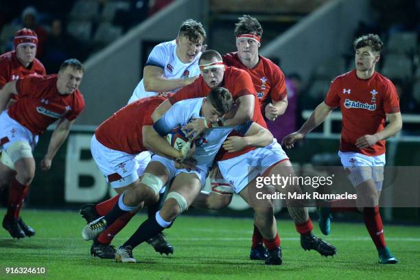 Aaron Hinkley of England is tackled by Sam Wainwright of wales in the second half during the RBS Under 20's Six Nations match between England U20 and...