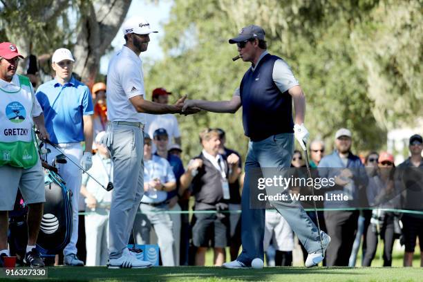Dustin Johnson and Wayne Gretzky meet at the 13th hole during Round Two of the AT&T Pebble Beach Pro-Am at Monterey Peninsula Country Club on...