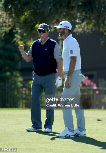 Wayne Gretzky and Dustin Johnson meet on the second hole during Round Two of the AT&T Pebble Beach Pro-Am at Monterey Peninsula Country Club on...