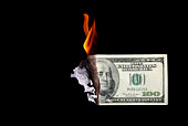 One hundred dollar bill burning