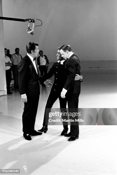 Entertainers Dean Martin , Sammy Davis Jr. And Frank Sinatra sing on stage during the taping of 'The Dean Martin Variety Show' circa 1967 in Los...
