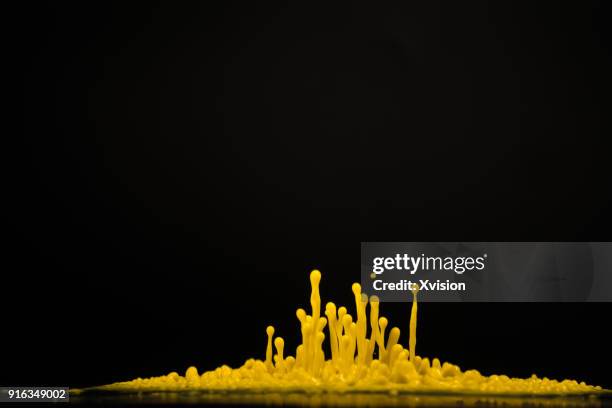 yellow dancing color with sound in black background studio shot - dancing studio shot stock pictures, royalty-free photos & images