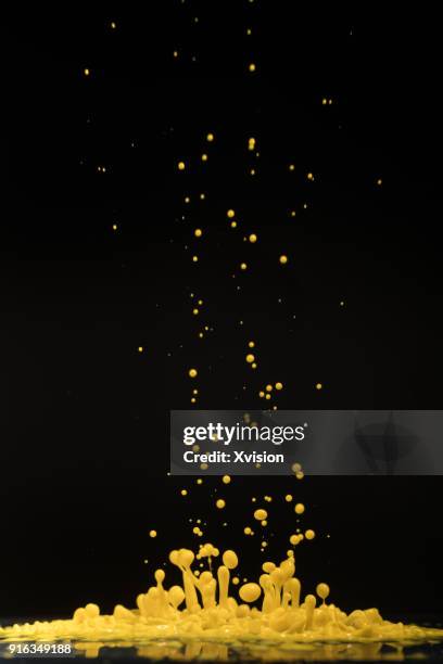 yellow dancing color with sound in black background studio shot - dancing studio shot stock pictures, royalty-free photos & images