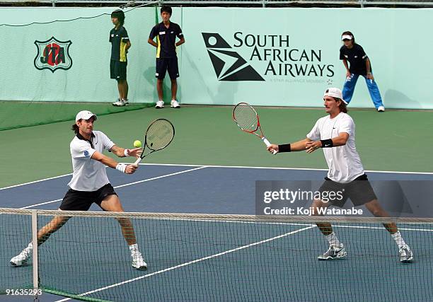 Christopher Kas of Germany and Jaroslav Levinsky of the Czech Republic returns a shot in their doubles match against Frantisek Cermak of the Czech...