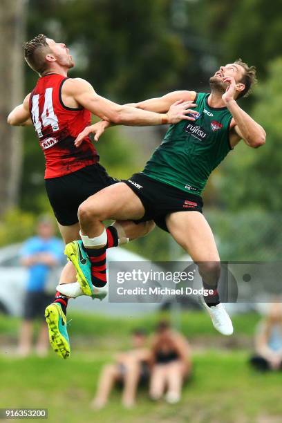 Shaun McKernan and Matthew Leuenberger compete for the ball during the Essendon Bombers AFL Intra-Club Match at The Hangar on February 10, 2018 in...