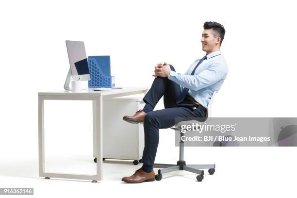 young businessman exercising in office - warm up exercise indoor stock pictures, royalty-free photos & images