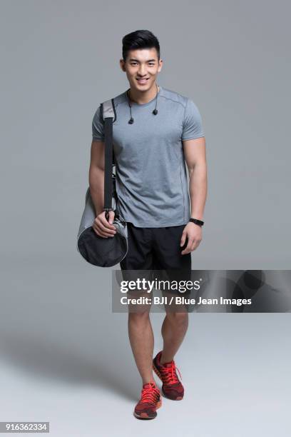 portrait of young male athlete - young men walking stock pictures, royalty-free photos & images