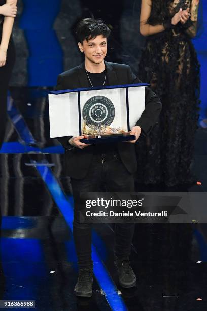 Italian singer Ultimo, winner of Nuove Proposte category of the 68th Italian Music Festival in Sanremo, poses with his trophy at the Ariston theatre...