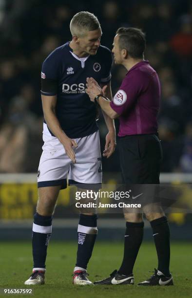 Steve Morison of Millwall argues with referee Keith Stroud during the Sky Bet Championship match between Millwall and Cardiff Cityat The Den on...