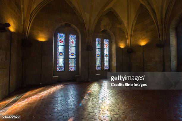 empty interior of church with stained glass windows, czech republic - stained glass czech republic stock pictures, royalty-free photos & images