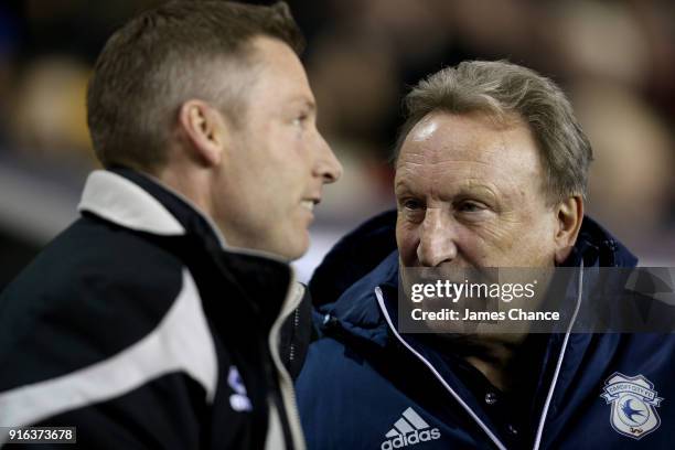 Neil Warnock, Manager of Cardiff City speaks to Neil Harris, manager of Millwall prior to the Sky Bet Championship match between Millwall and Cardiff...