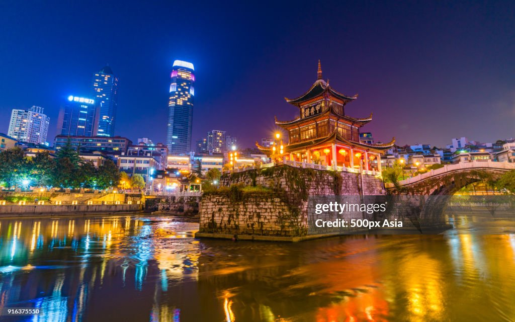 Jiaxiu Pavilion in lake at night, Guiyang, Guizhou Province, China