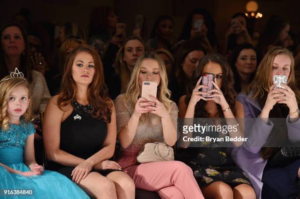 Cara Mund, Torri Webster and Madison Pettis attend the NYFW Sherri Hill Runway Show on February 9, 2018 in New York City.