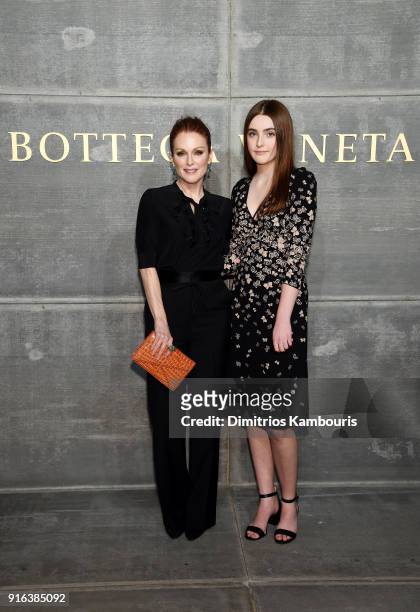 Julianne Moore and Liv Freundlich attend the Bottega Veneta Fall/Winter 2018 fashion show at New York Stock Exchange on February 9, 2018 in New York...