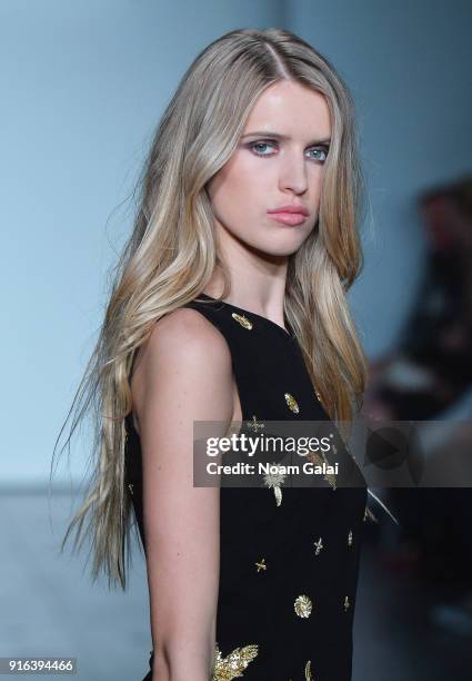 Model walks the runway during Mary Kary at Nicole Miller Fall 2018 at Industria Studios on February 9, 2018 in New York City.