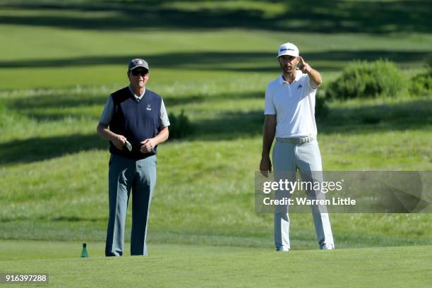 Wayne Gretzky and Dustin Johnson line up a shot on the second hole during Round Two of the AT&T Pebble Beach Pro-Am at Monterey Peninsula Country...