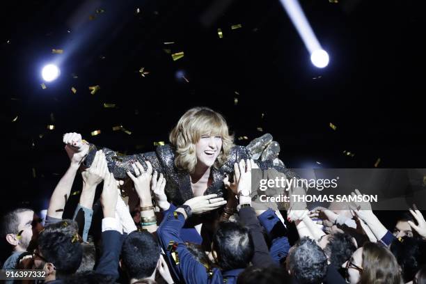 French Tv host Daphne Burki celebrates with the audience during the 33rd Victoires de la Musique, the annual French music awards ceremony, on...