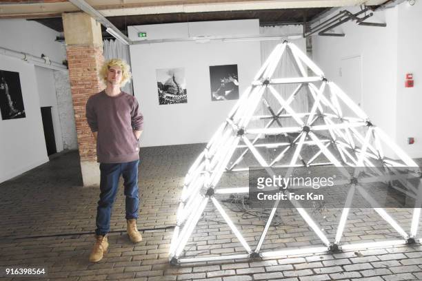 Artist Nelson Pernisco poses with his pyramid during the "Hors Cadre" Exhibition Gallery Opening Preview on February 9, 2018 in Paris, France.