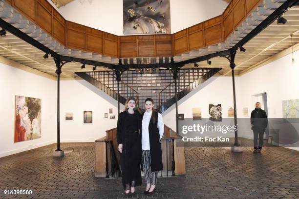 Hors Cadre Gallery cofounders Oceane Sailly and Manon Sailly pose in an ancient hardware store transformed into a gallery during the "Hors Cadre"...