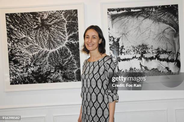 Lea Barbazanges poses with her work during the "Hors Cadre" Exhibition Gallery Opening Preview on February 9, 2018 in Paris, France.