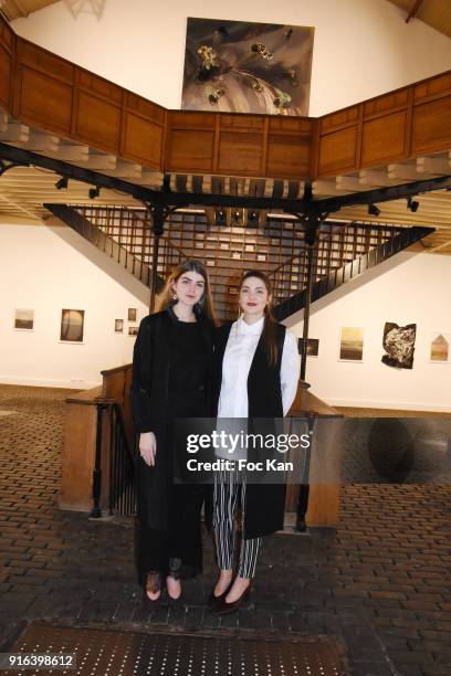 Hors Cadre Gallery cofounders Oceane Sailly and Manon Sailly pose in an ancient hardware store transformed into a gallery during the "Hors Cadre"...