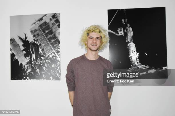 Artist Nelson Pernisco poses with his work during the "Hors Cadre" Exhibition Gallery Opening Preview on February 9, 2018 in Paris, France.