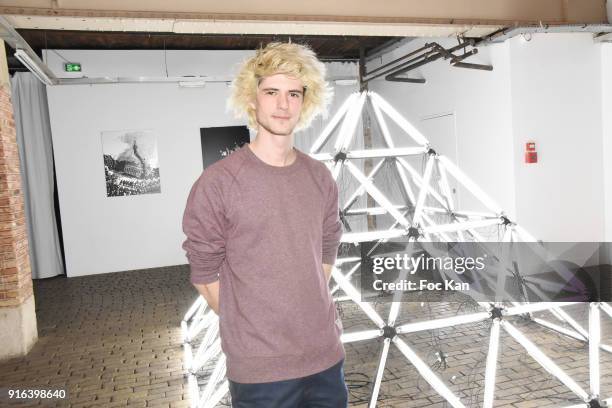 Artist Nelson Pernisco poses with his work during the "Hors Cadre" Exhibition Gallery Opening Preview on February 9, 2018 in Paris, France.