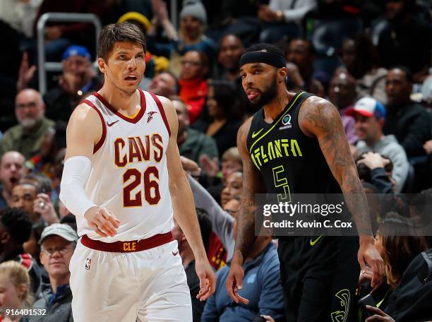 Kyle Korver of the Cleveland Cavaliers reacts after hitting a three-point basket against Malcolm Delaney of the Atlanta Hawks to end the third...