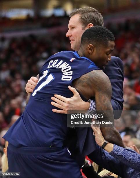 Jamal Crawford of the Minnesota Timberwolves lands in the arms of head coach Fred Hoiberg of the Chicago Bulls after diving for a loose ball at the...