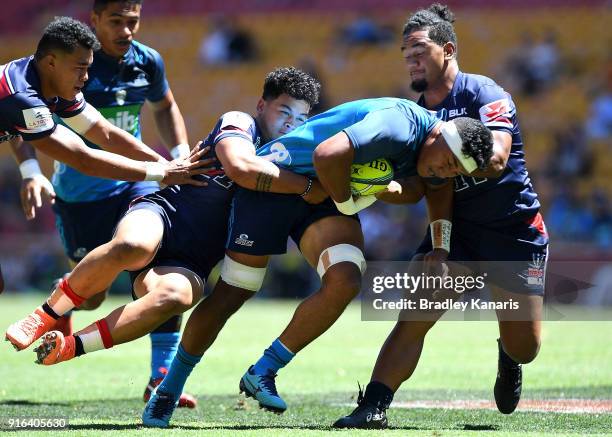 Murphy Taramai of the Blues takes on the defence during the 2018 Global Tens match between the Blues and Melbourne Rebels at Suncorp Stadium on...