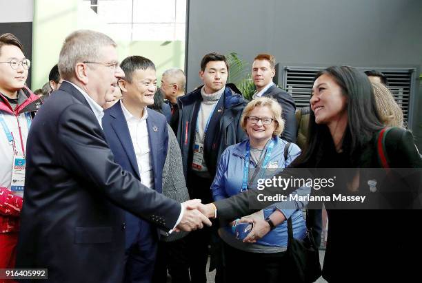 President Thomas Bach and Alibaba Group Executive Chairman Jack Ma greet Olympic figure skater Michelle Kwan at the Alibaba Showcase at the...