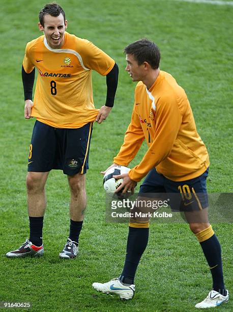 Luke Wilkshire shares a laugh with Harry Kewell during an Australian Socceroos training session at the Sydney Football Stadium on October 9, 2009 in...