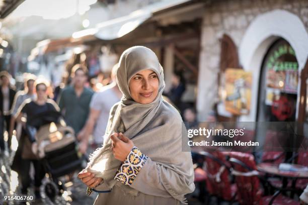 muslim woman on street - bosnia stockfoto's en -beelden