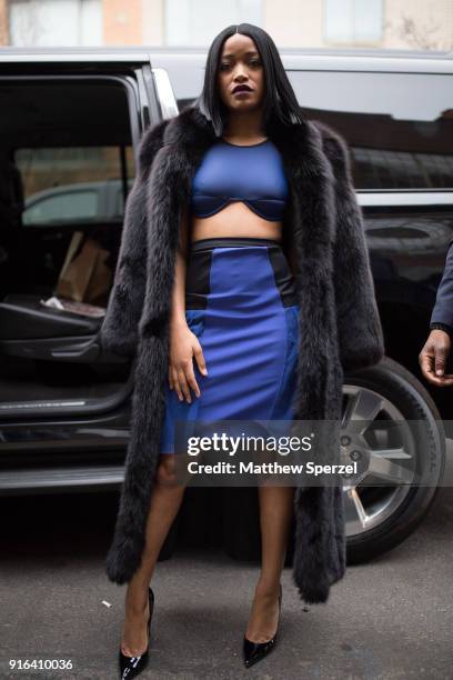Keke Palmer is seen wearing a fur coat with blue dress on the streets outside the Chromat show during New York Fashion Week on February 9, 2018 in...