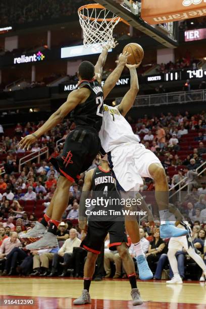 Trey Lyles of the Denver Nuggets goes up for a shot defended by Markel Brown of the Houston Rockets in the second half at Toyota Center on February...