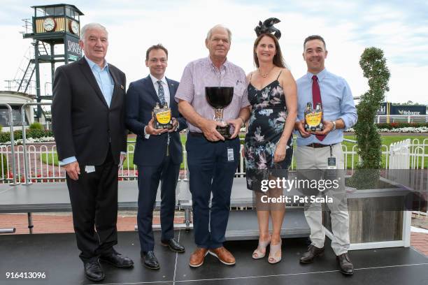 Owner Peter Robinson, Andrew Noblet and connections of Super Cash pose with the trophy after winning the Schweppes Rubiton Stakes at Caulfield...