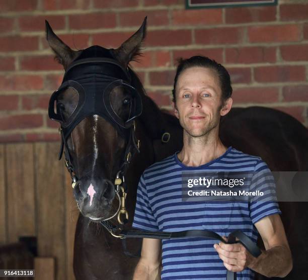 Strapper Brett Papworth poses with Super Cash after winning the Schweppes Rubiton Stakes at Caulfield Racecourse on February 10, 2018 in Caulfield,...