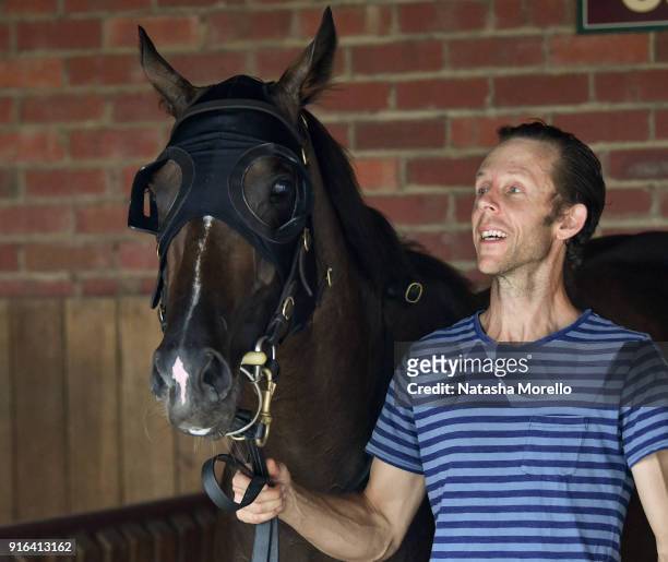 Strapper Brett Papworth poses with Super Cash after winning the Schweppes Rubiton Stakes at Caulfield Racecourse on February 10, 2018 in Caulfield,...