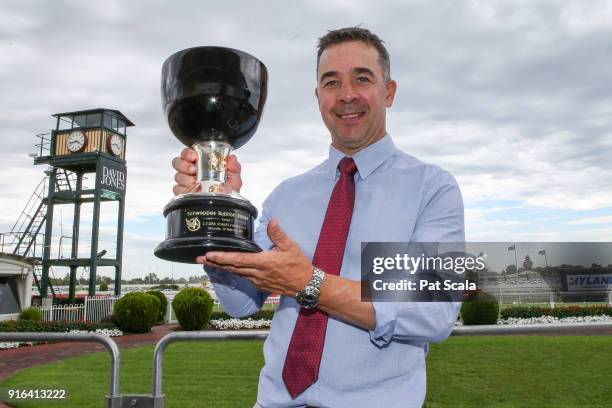 Trainer Andrew Noblet poses with the trophy after Super Cash wins the Schweppes Rubiton Stakes at Caulfield Racecourse on February 10, 2018 in...