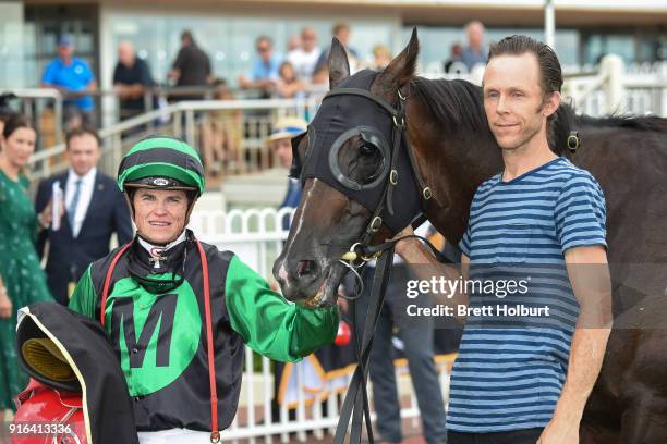 Craig Williams poses with Super Cash after winning the Schweppes Rubiton Stakes at Caulfield Racecourse on February 10, 2018 in Caulfield, Australia.